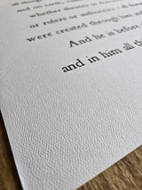 Text on a white paper with a wooden surface underneath