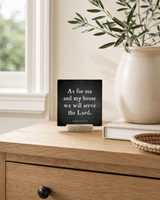 As for Me and My House 4x4 Christian Shelf Sitter on a light console by a window with olive branches, stoneware, and a woven tray.