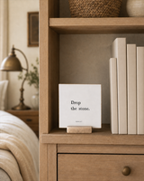 Drop the Stone 4x4 Christian shelf sitter with natural wood base, styled in a bedroom bookcase scene.