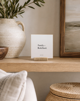 Family Redefined 4x4 Christian shelf sitter with natural wood base, styled in a family room floating shelf scene.