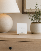 Following Jesus Makes Life Better 4x4 Christian shelf sitter with natural wood base, styled in a apartment sideboard scene.