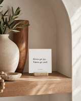 Givers Get Joy 4x4 Christian shelf sitter with natural wood base, styled in a arched alcove shelf scene.