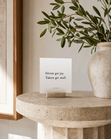 Givers Get Joy 4x4 Christian shelf sitter with natural wood base, styled in a foyer pedestal table scene.