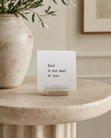 God Is Not Mad at You 4x4 Christian shelf sitter with natural wood base, styled in a foyer pedestal table scene.
