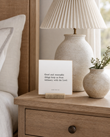Good and Reasonable Things 4x4 Christian shelf sitter with natural wood base, styled in a coastal bedside table scene.