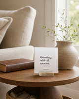 Groaning With All Creation 4x4 Christian shelf sitter with natural wood base, styled in a prayer corner side table scene.