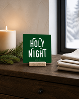 Dark Green 4x4 Holy Night Christmas Shelf Sitter in a moonlit bedroom console with its rustic wood slot stand.