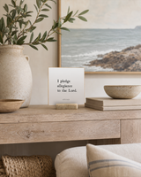 I Pledge Allegiance to the Lord 4x4 Christian shelf sitter with natural wood base, styled in a coastal living room console scene.