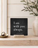 I Am With You Always 4x4 Christian Shelf Sitter on a wood console with a brass key tray, white vase, and olive branches.