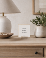 I've Still Got Joy in Chaos 4x4 Christian shelf sitter with natural wood base, styled in a apartment sideboard scene.