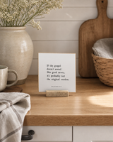If the Gospel Doesn't Sound Like Good News 4x4 Christian shelf sitter with natural wood base, styled in a modern farmhouse kitchen nook scene.