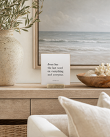 Jesus Has the Last Word 4x4 Christian shelf sitter with natural wood base, styled in a coastal living room console scene.