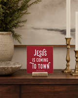 Red 4x4 Jesus Is Coming to Town Christmas Shelf Sitter in a library console without books with its rustic wood slot stand.