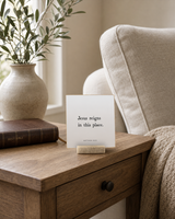 Jesus Reigns in This Place 4x4 Christian shelf sitter with natural wood base, styled in a prayer corner side table scene.