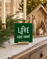 Dark Green 4x4 Love Came Down Christmas Shelf Sitter in a christmas dining sideboard with its rustic wood slot stand.