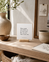 Many People Don't Believe in the Jesus Story 4x4 Christian shelf sitter with natural wood base, styled in a creative studio shelf scene.