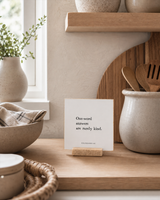 One-Word Answers Are Rarely Kind 4x4 Christian shelf sitter with natural wood base, styled in a modern farmhouse kitchen nook scene.