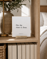 One Day Closer to Jesus 4x4 Christian shelf sitter with natural wood base, styled in a bedroom bookcase scene.