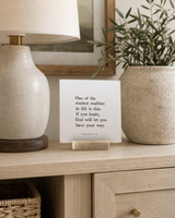One of the Scariest Realities in Life 4x4 Christian shelf sitter with natural wood base, styled in a apartment sideboard scene.