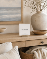 Post Genesis 3 4x4 Christian shelf sitter with natural wood base, styled in a coastal living room console scene.