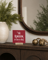 Red 4x4 The Kingdom of God Is Here Christmas Shelf Sitter in a arched entry cabinet with its rustic wood slot stand.