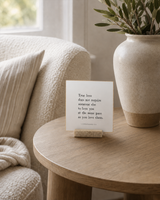 True Love Does Not Require the Same Pace 4x4 Christian shelf sitter with natural wood base, styled in a reading chair side table scene.