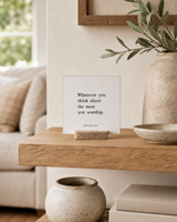 Whatever You Think About the Most You Worship 4x4 Christian shelf sitter with natural wood base, styled in a family room floating shelf scene.