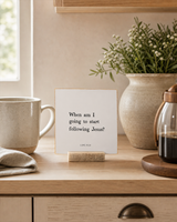 When Am I Going to Start Following Jesus 4x4 Christian shelf sitter with natural wood base, styled in a modern farmhouse kitchen nook scene.