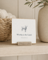 Worthy Is the Lamb lamb Scripture shelf sitter with Revelation 5:12, styled in the serene nursery built-in shelf scene.