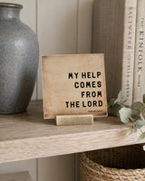 My Help Comes From the Lord 4x4 Christian Shelf Sitter on a light wood shelf beside a gray vase, pale books, and eucalyptus.